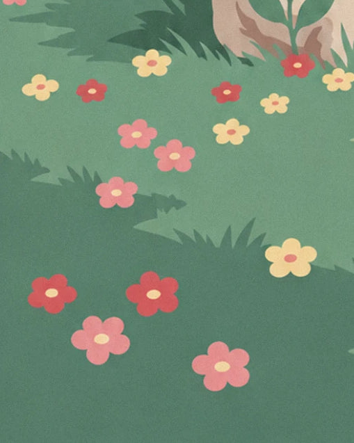 Prairie verte semée de fleurs rouges, roses et jaunes, au pied d'un rocher