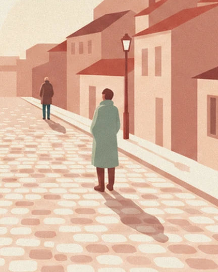 The passer-by in a sea green coat on the pink cobbles, with a street lamp and another walker in the distance