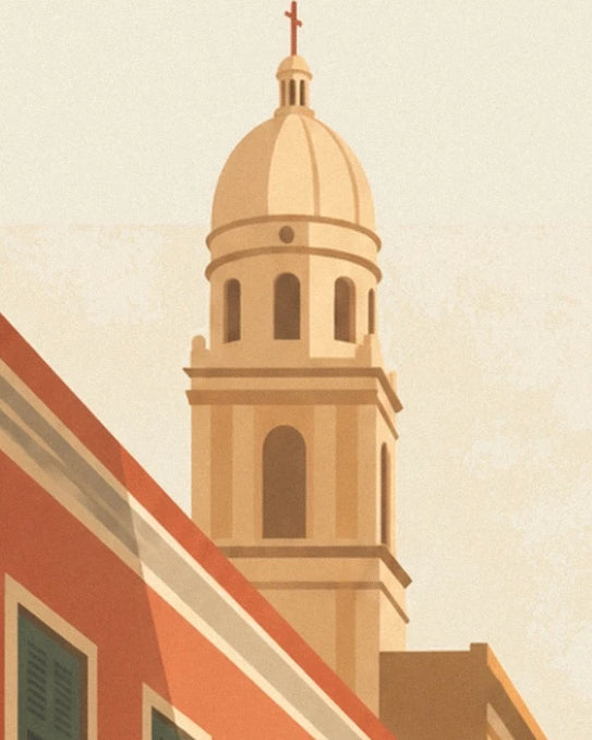 The ochre bell tower topped with a dome and cross above the rooftops