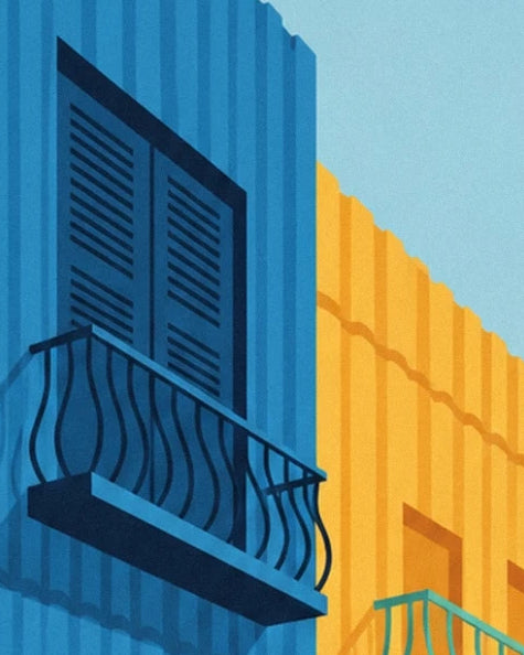 The wrought iron balcony and its blue shutters facing a yellow corrugated metal façade