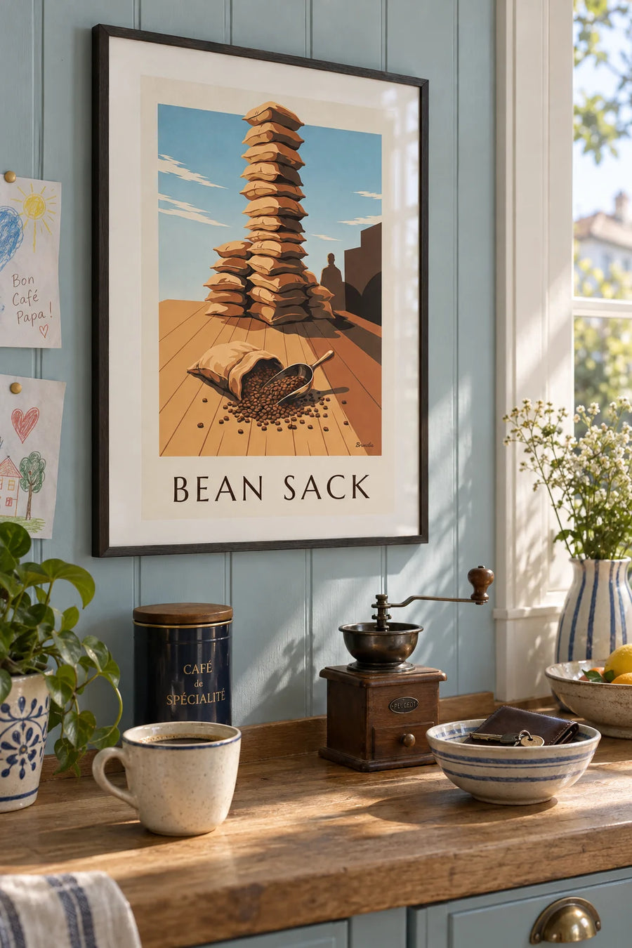 Poster of roasted coffee beans and an open jute sack: framed on the wall
