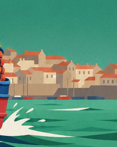 The pale houses with red roofs around the harbour behind the foaming waves