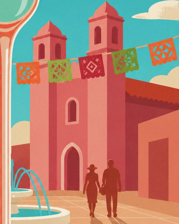 Un couple main dans la main devant une église rose aux 2 clochers et ses fanions colorés