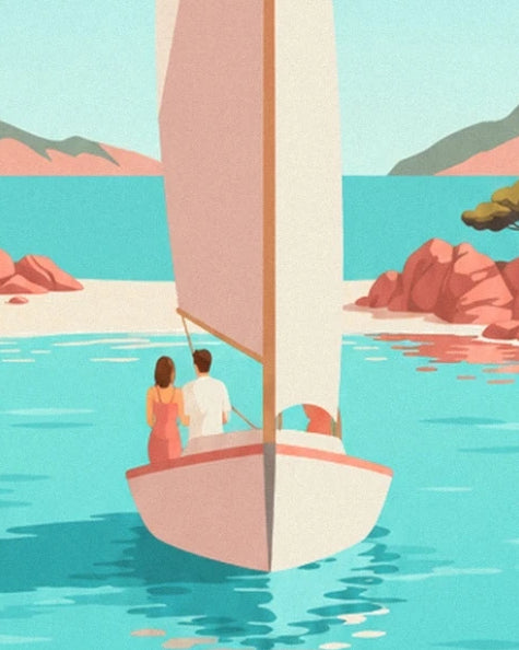 A couple aboard a sailing boat with cream and pink sails on the turquoise water