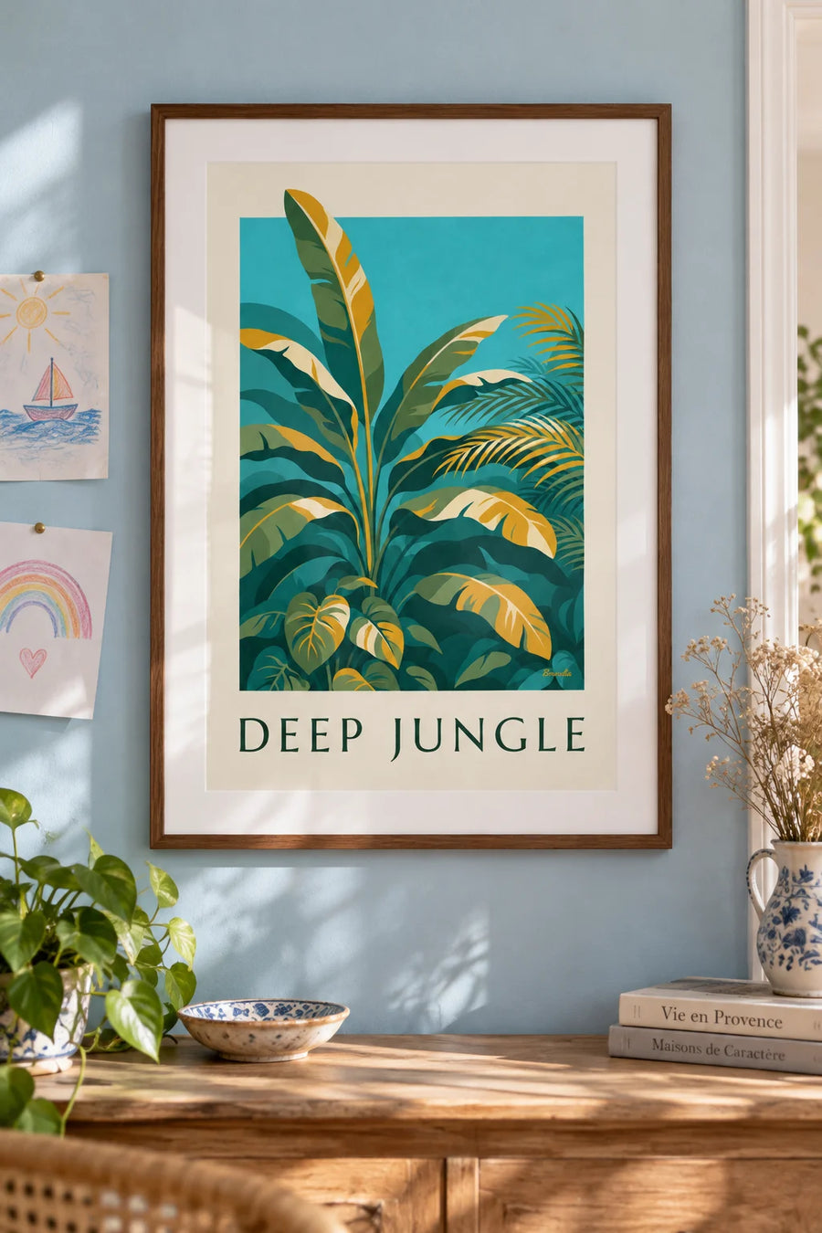 Poster of large tropical jungle leaves in shades of green: framed on the wall