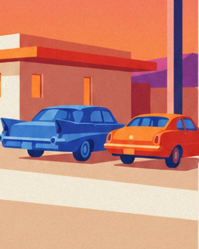 A blue American car with tail fins and a small orange car parked in front of the motel