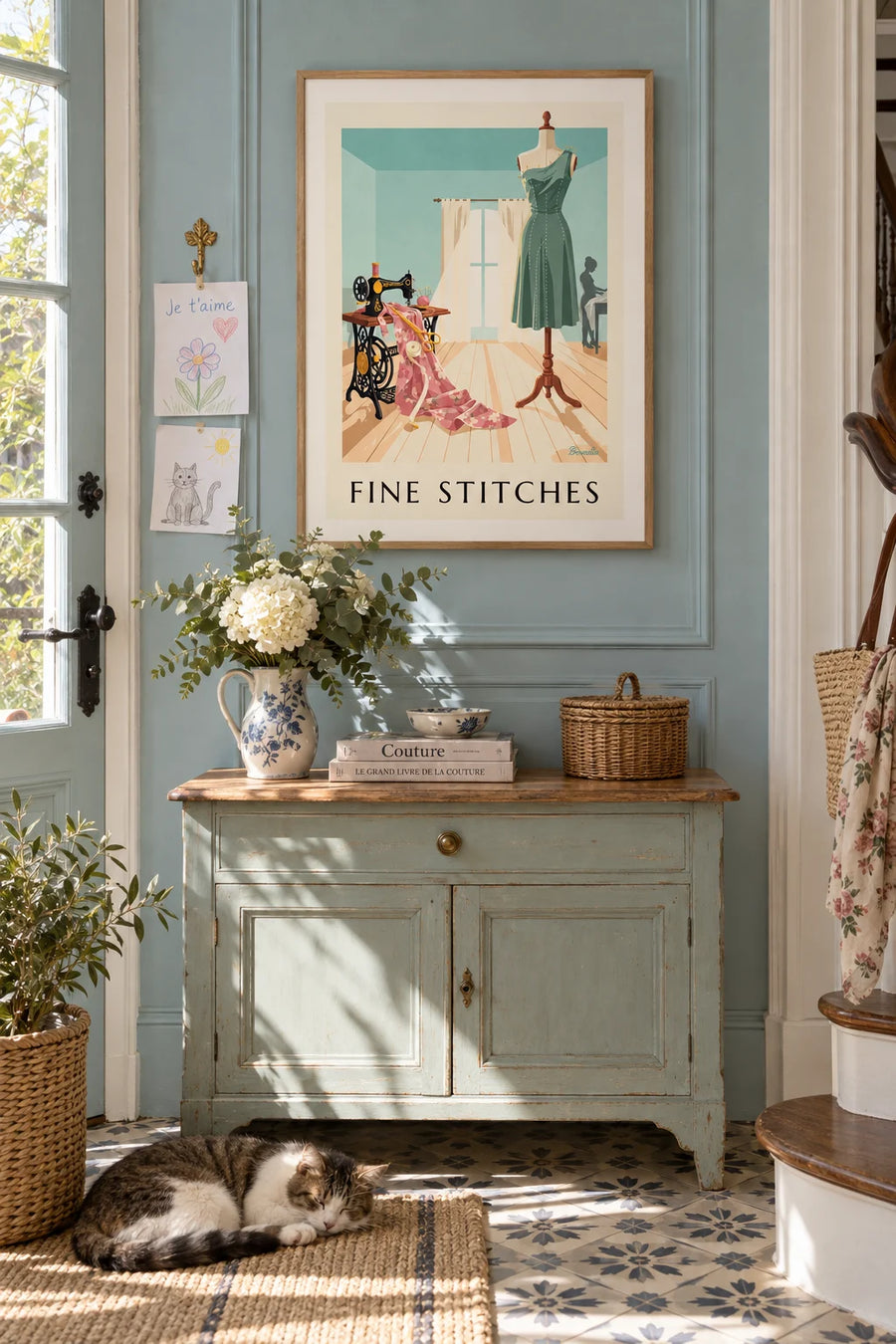 Poster of a sewing machine in front of the studio window: framed on the wall