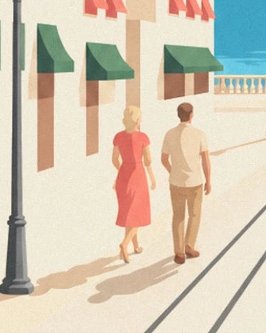 A couple in a coral dress and pale shirt beside the façades with green awnings