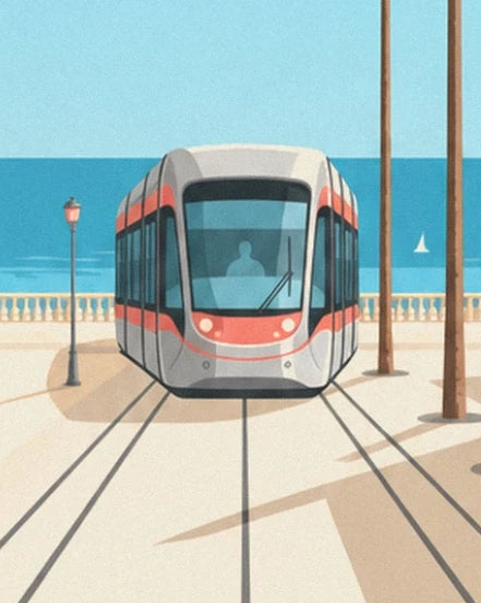 The grey and red tram on its tracks, facing the sea and a white sailing boat