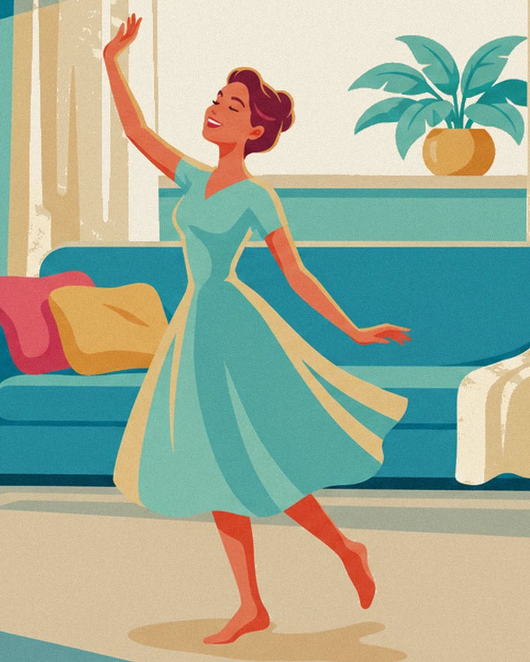 The dancer in a turquoise dress with one arm raised in front of the sofa with colourful cushions