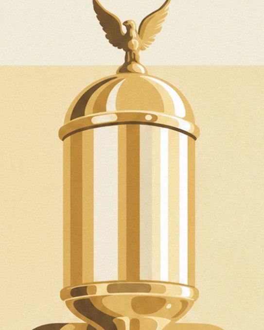 The golden tank of the espresso machine, topped with an eagle with outstretched wings