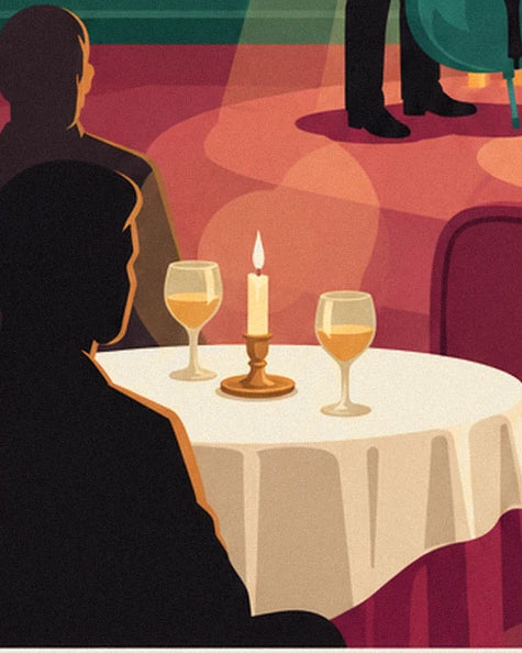 A table with a white tablecloth, its 2 golden glasses and candle between the silhouettes