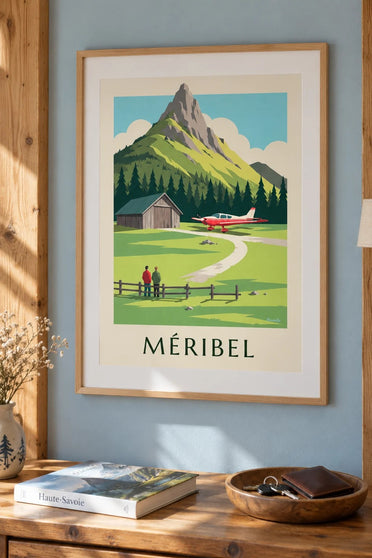 Plakat med Méribel og lille fly ved højfjeldslufthavnen : indrammet på væggen