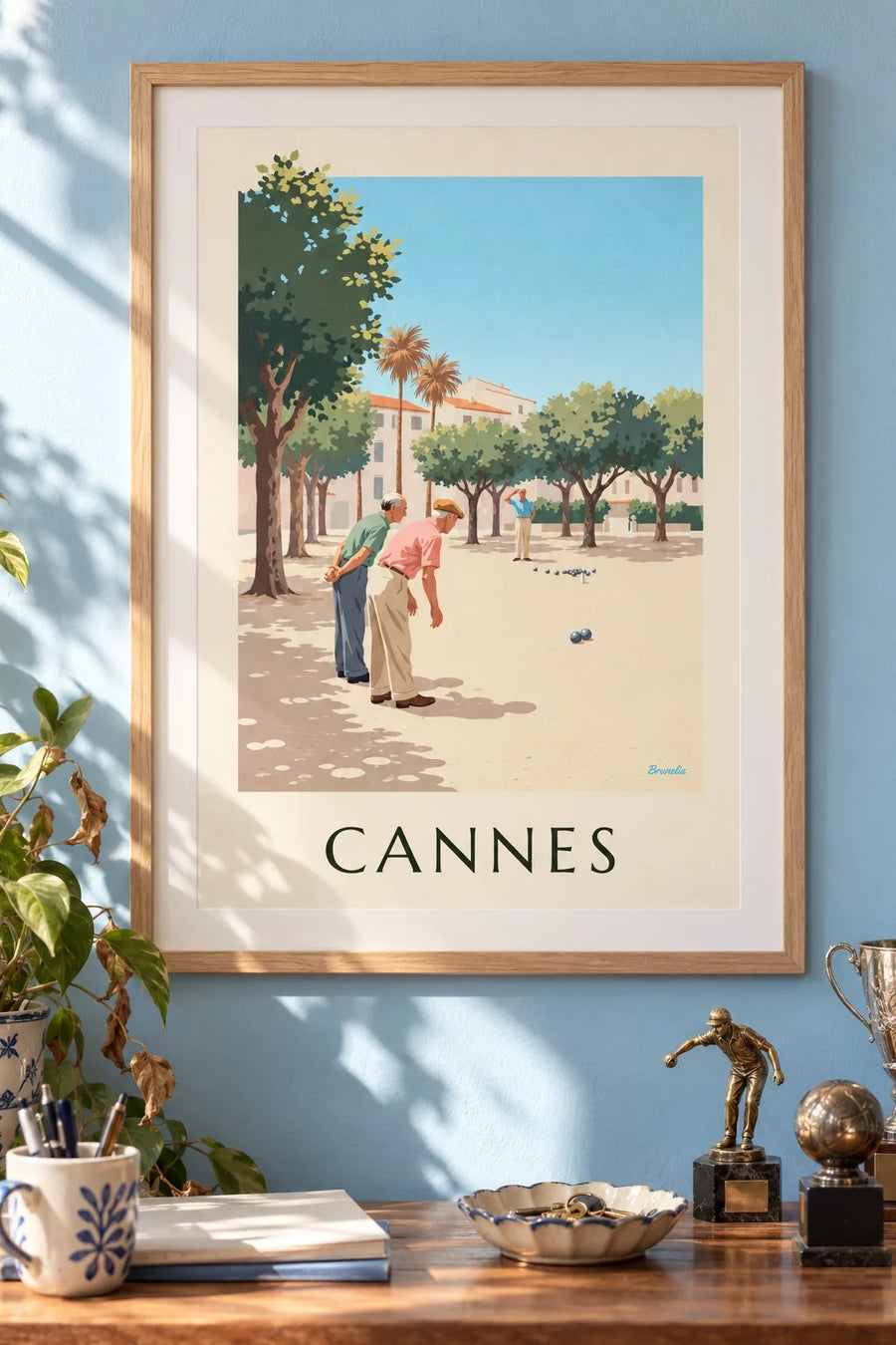 Plakat med pétanque under platantræerne i Cannes : indrammet på væggen