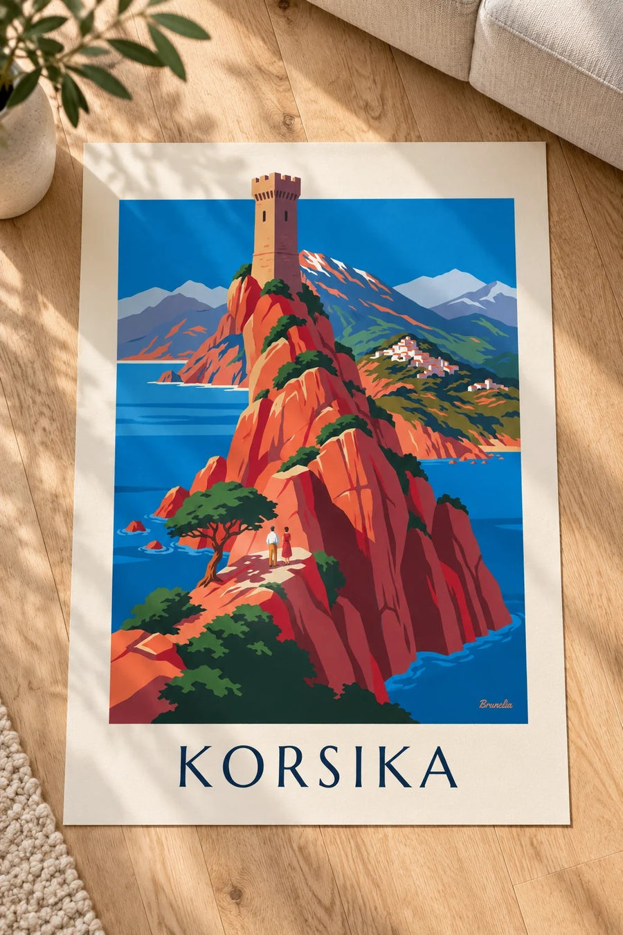 Plakat med Korsikas vilde kyst, røde klipper og Monte Cinto: lagt fladt på et bord