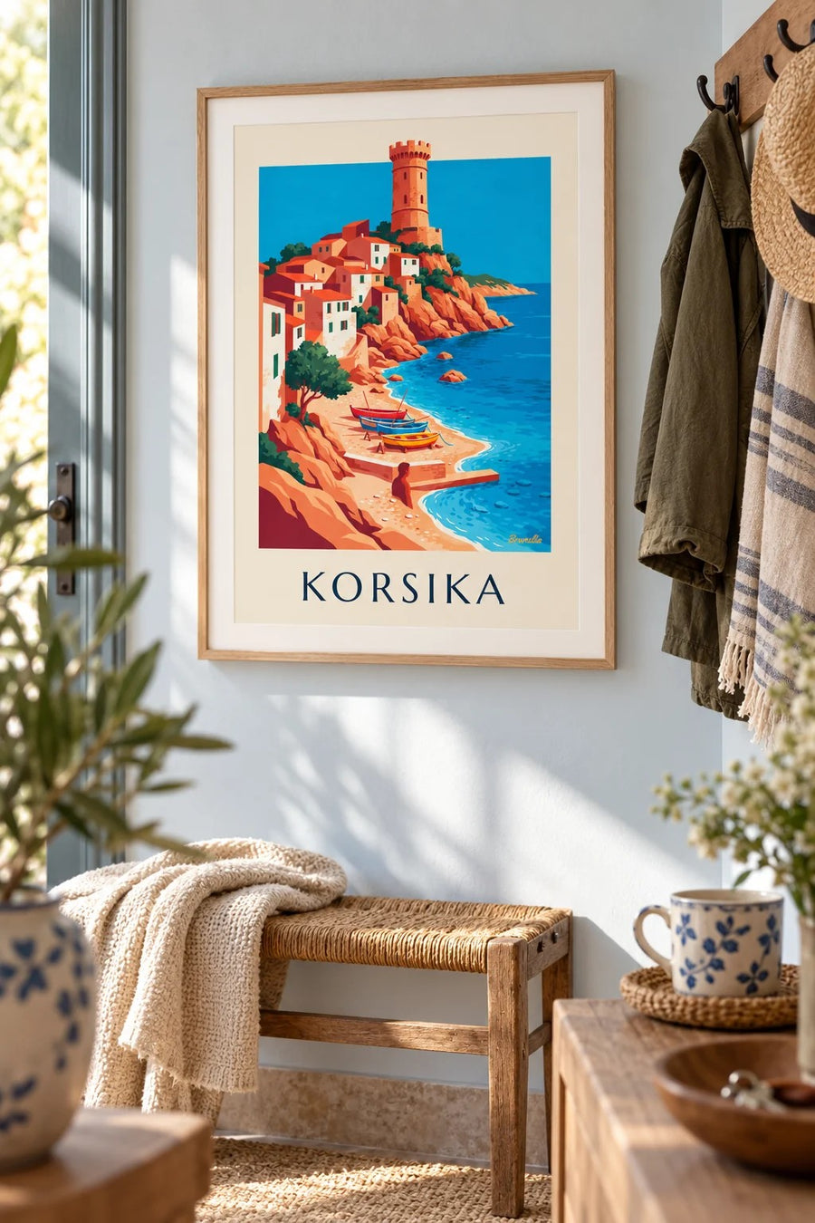 Plakat med kystby, genuesisk tårn og både på Korsika: indrammet på væggen