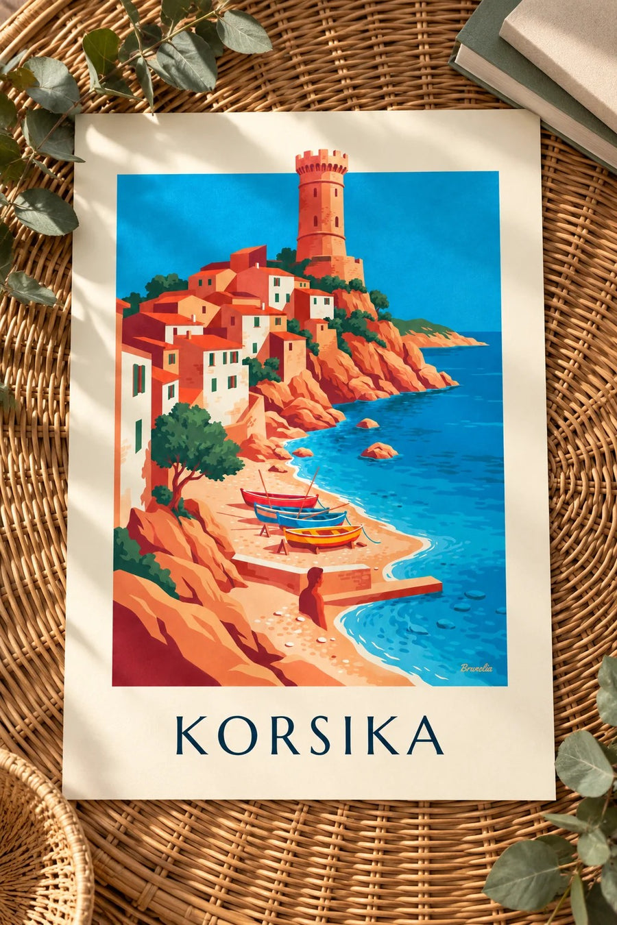 Plakat med kystby, genuesisk tårn og både på Korsika: lagt fladt på et bord