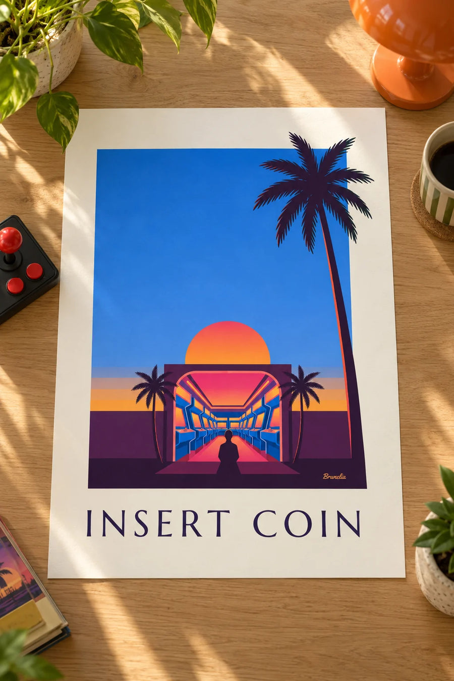 Plakat med arkadehal, neonlys og nedgående sol: placeret på et bord