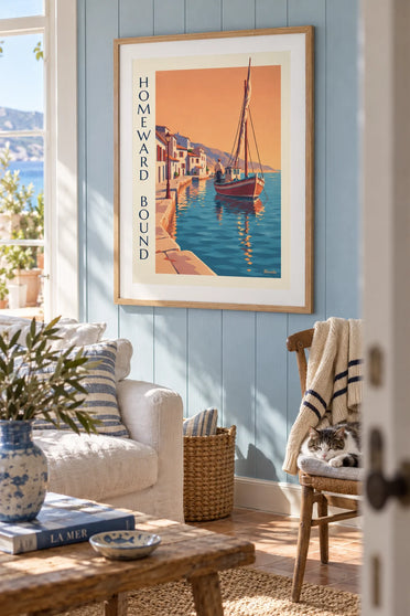 Poster of a traditional fishing boat returning to port at sunset: framed on the wall