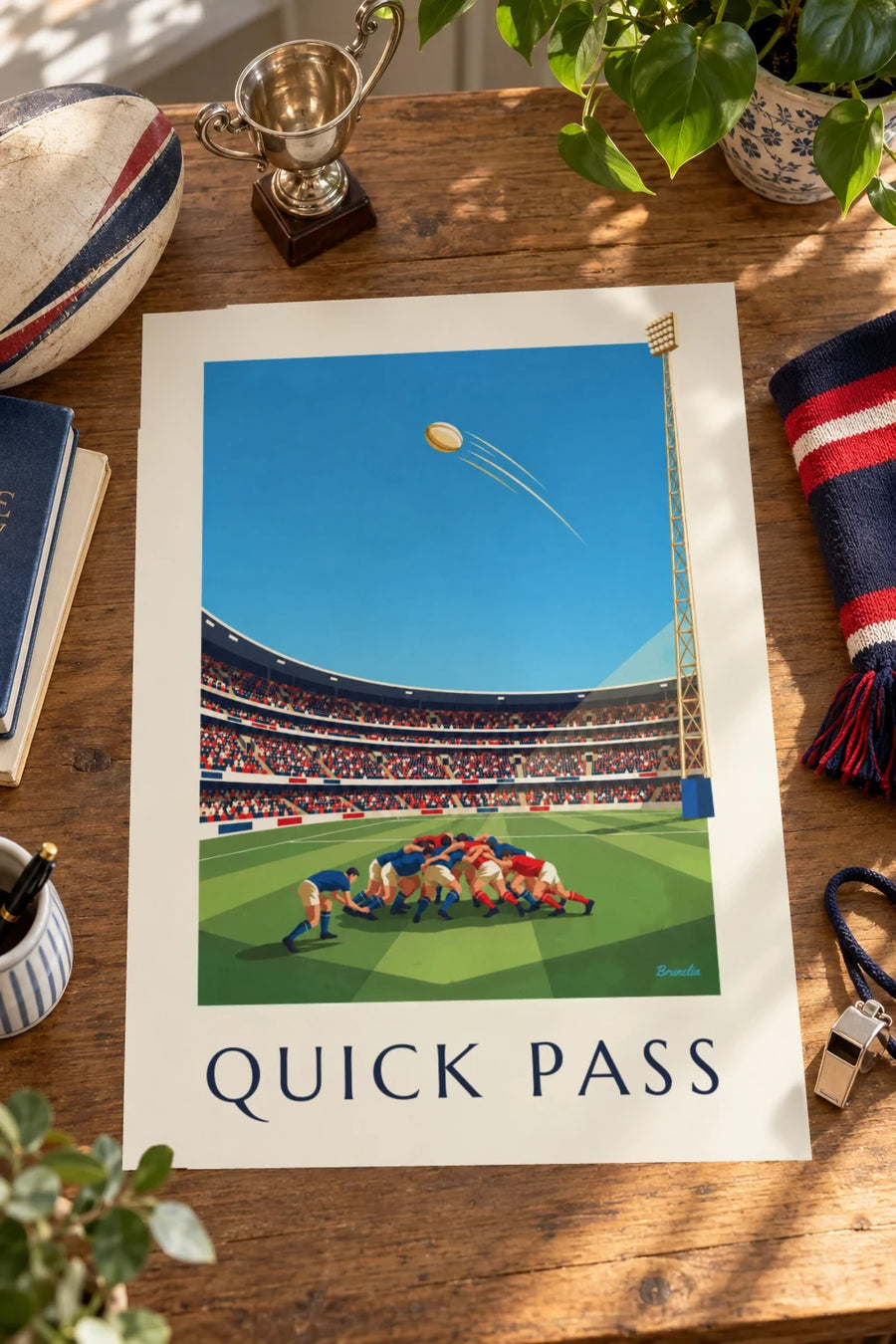 Plakat af en scrum-half, der kaster bolden ud af scrummen: stående på et bord