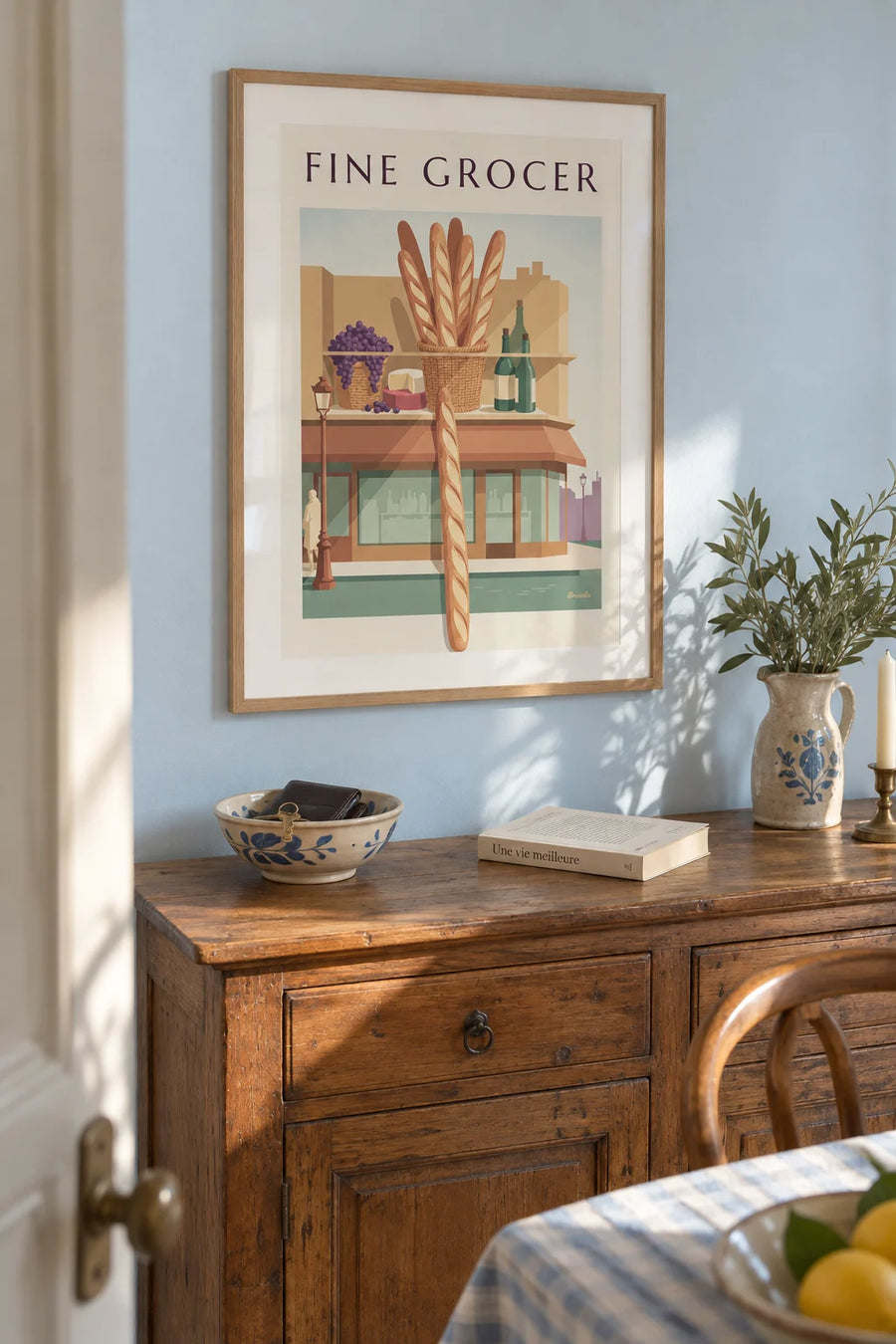 Gourmet delicatessen with grapes, baguettes, cheeses and wines poster: framed on the wall