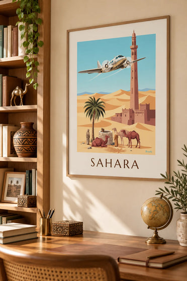 Plakat med tremotoret fly over en oase og Saharas klitter: indrammet på væggen